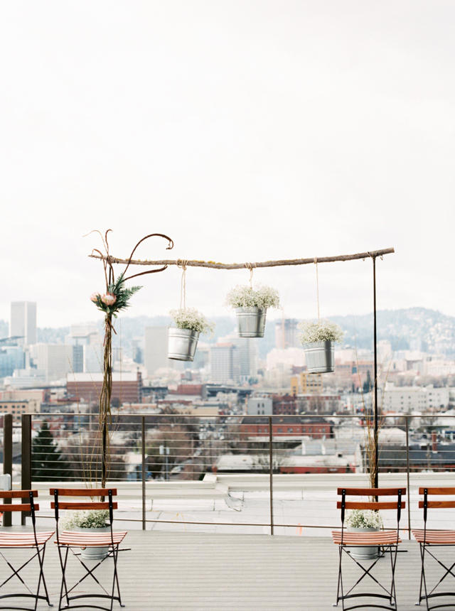 simple wooden archway ceremony backdrop