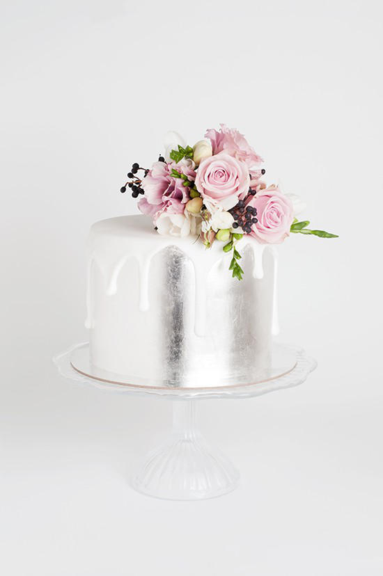 silver wedding cake with flowers