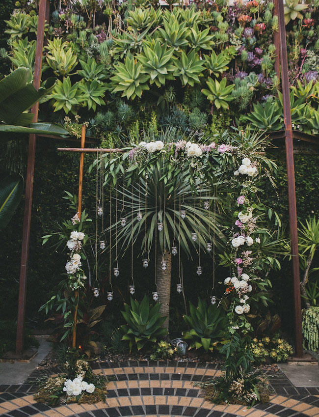 industrial wedding with greenery installation idea