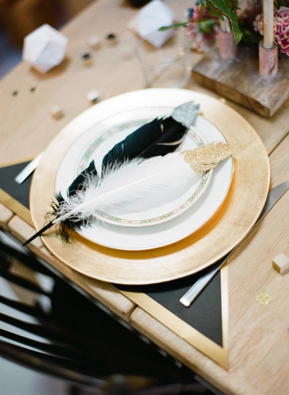 monochrome wedding table styling with feathers