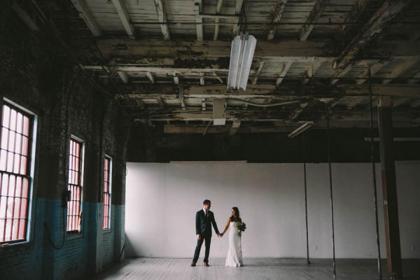 urban wedding bride and groom in warehouse